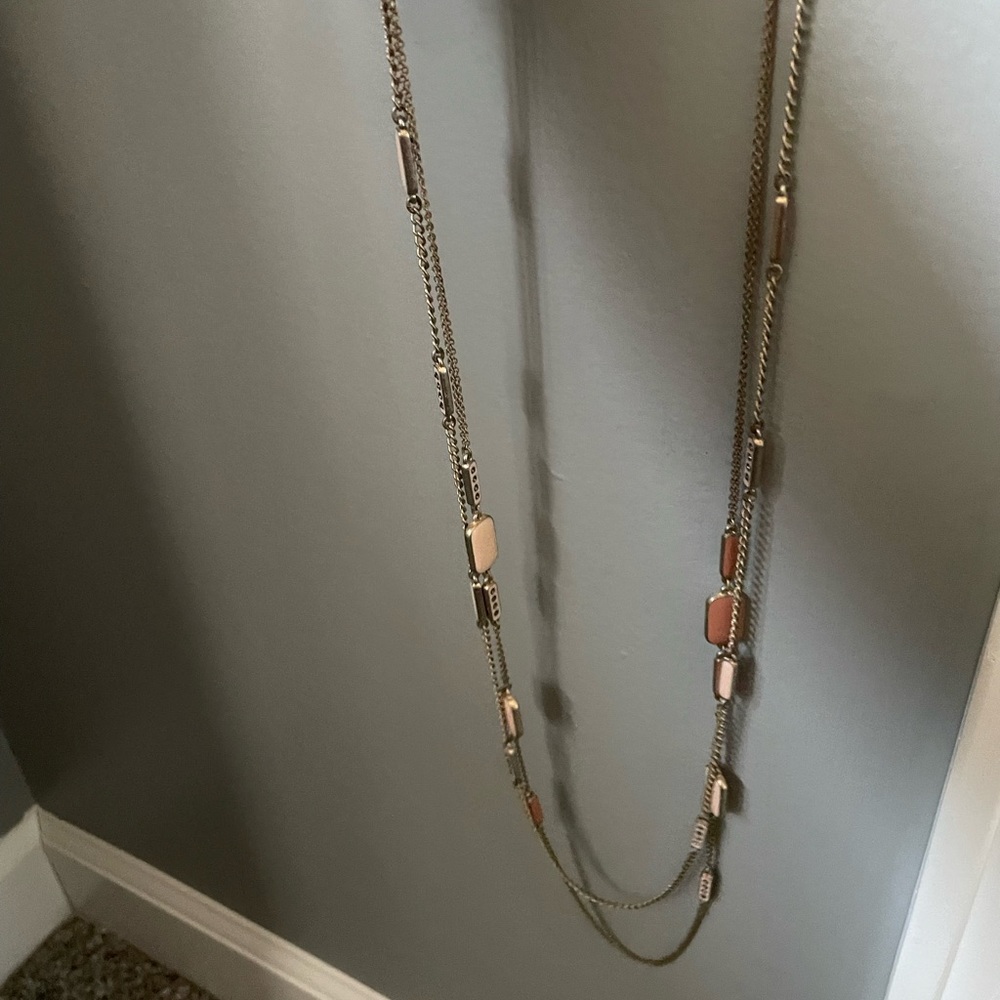 Beige necklace.